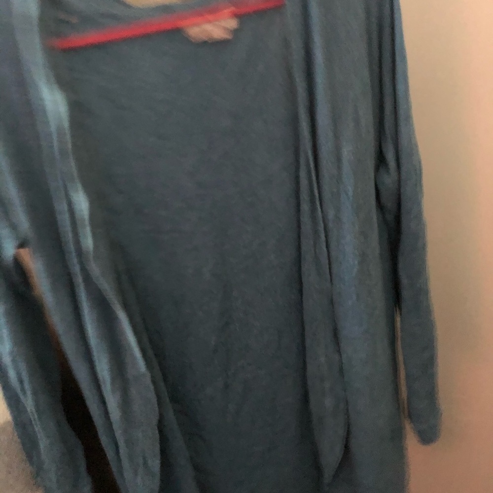 Blue cardigan. Never worn. Small